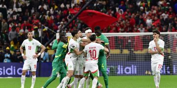 Abdoulaye Seck (C-R) of Senegal scuffles with Brahim Diaz (C) of Morocco during the CAF Africa