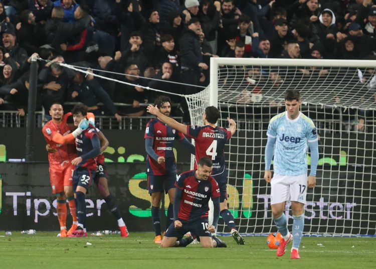 Players of Cagliari celebrate the victory at the end of the Italian Serie A soccer match between Cagliari Calcio and Juventus