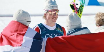 ohannes Hoesflot Klaebo (C) and team Norway celebrate winning in the Men's 4x7.5km Relay of the Cross-Country Skiing