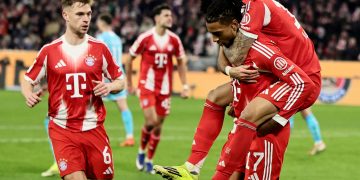 Luis Diaz of Munich (R) celebrates with teammates after scoring the 4-1 lead during the German Bundesliga soccer match between FC Bayern Munich and TSG Hoffenheim in Munich