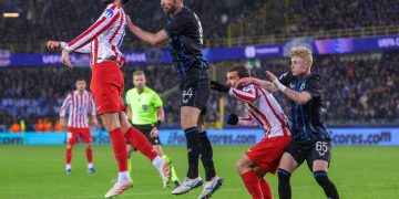 David Hancko of Atletico (L) and Brandon Mechele of Club Brugge vie for the ball during the UEFA Champions League play-offs 1st leg match between Club Brugge KV and Atletico Madrid, in Bruges