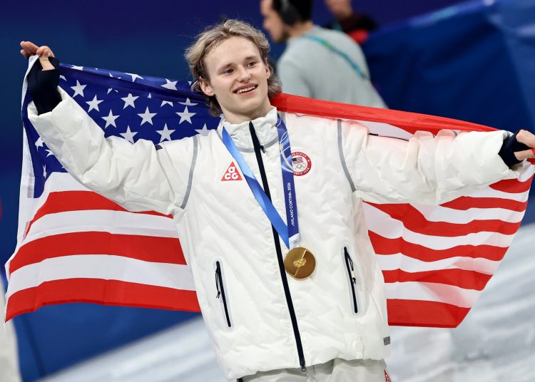 Ilia Malinin, gold medalist from team USA celebrates after the medal ceremony