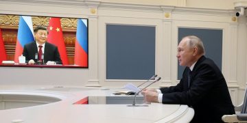 Vladímir Putin y Xi Jinping durante su videoconferencia estratégica
