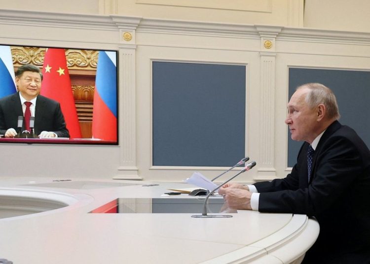Vladímir Putin y Xi Jinping durante su videoconferencia estratégica