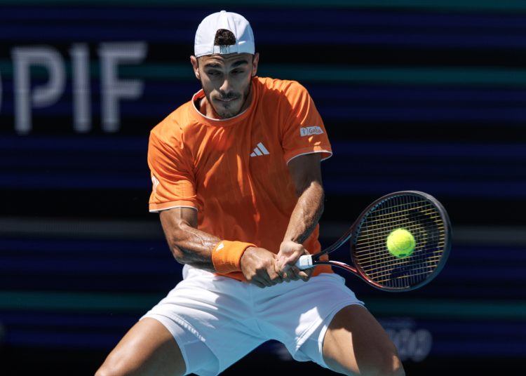 Francisco Cerundolo of Argentina in action against Daniil Medvedev of Russia during the Men's Singles