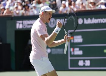 Jannik Sinner of Italy reacts after winning match point during the men’s singles semifinal