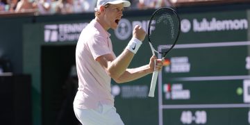 Jannik Sinner of Italy reacts after winning match point during the men’s singles semifinal