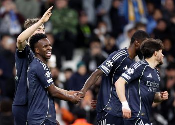 Vinicius Junior (L) of Real Madrid celebrates with teammates after scoring his second goal during the UEFA
