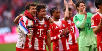 Munich players applaud to supporters after winning the German Bundesliga soccer match between FC Bayern