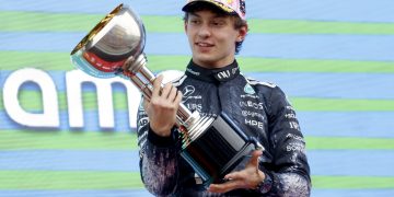 Mercedes driver Andrea Kimi Antonelli of Italy celebrates on the podium after winning the Formula 1 Japanese Grand