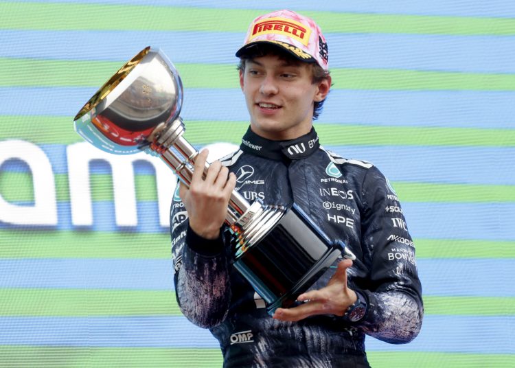 Mercedes driver Andrea Kimi Antonelli of Italy celebrates on the podium after winning the Formula 1 Japanese Grand