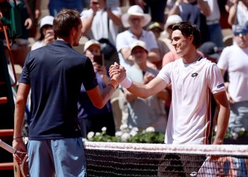 Adam Walton (R) of Australia is congratulated at the net by Daniil Medvedev of Russia after he won their Men's 1st round match at the French Open Grand Slam
