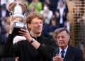 Jannik Sinner of Italy celebrates with the trophy after winning the Men's Singles final tennis