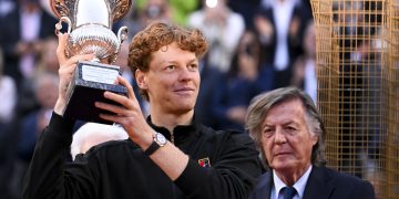 Jannik Sinner of Italy celebrates with the trophy after winning the Men's Singles final tennis
